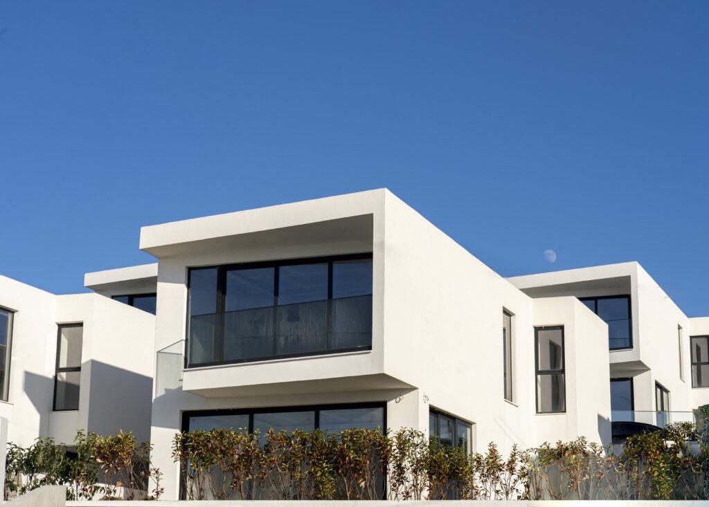 villas in palmera resort albania showcasing the achitectural design of the white property in saranda albania and big windows