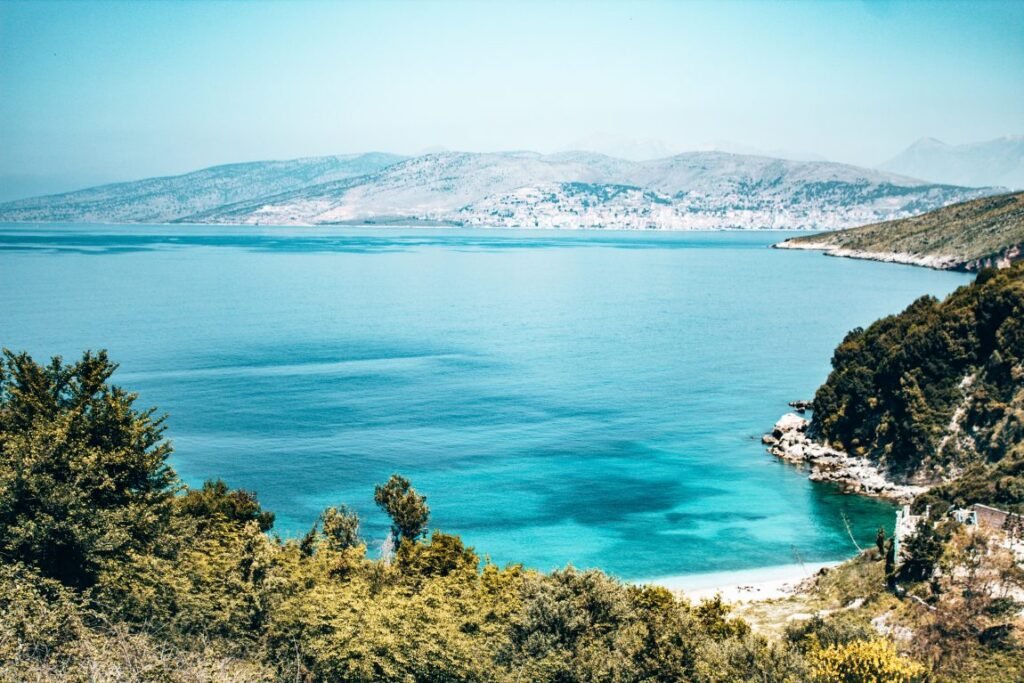 Monastery Beach photo showing the sandy landscape along with big forest and greenery with views of saranda albania