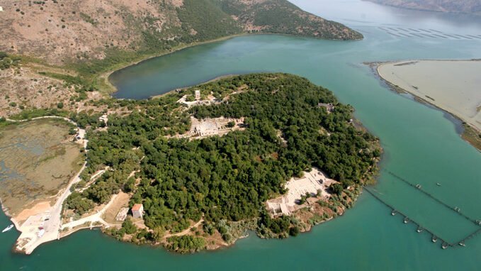 Butrint Park in Albania - a UNESCO World Heritage Site surrounded by lush greenery, ancient ruins, and sparkling waterways