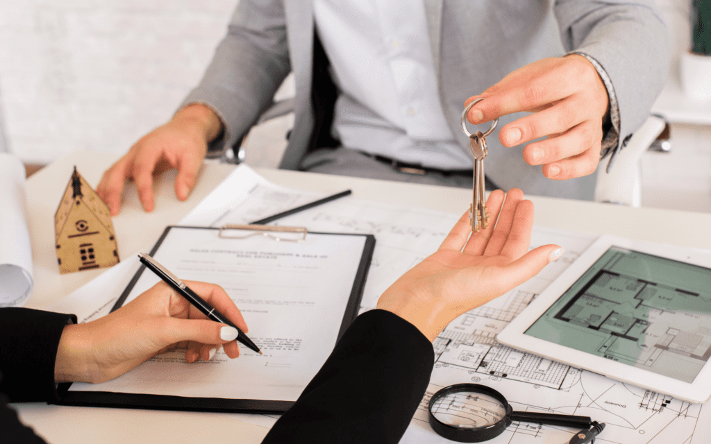 man giving keys to manage property in albania