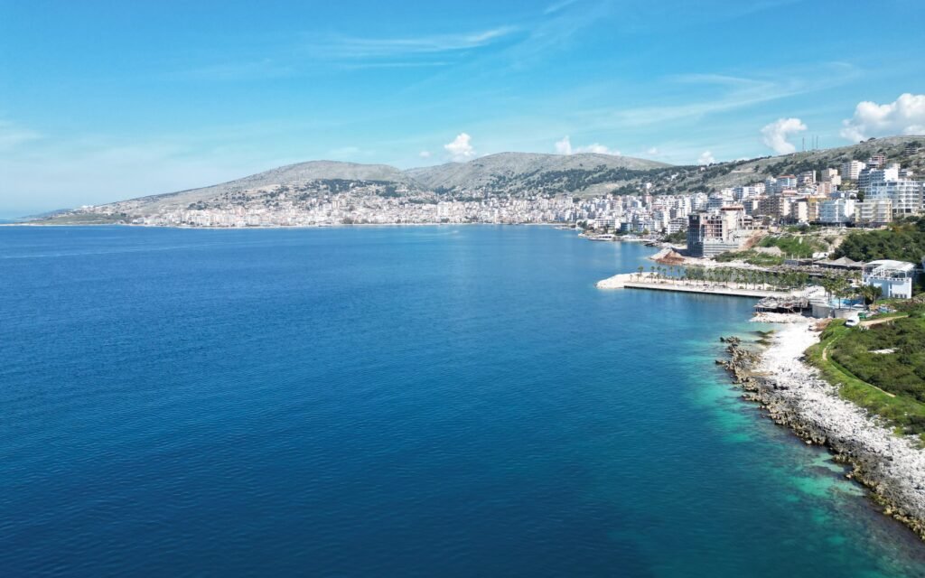 saranda albania beach and city landscape of natural beaches and urban architecture and mountains with greenery