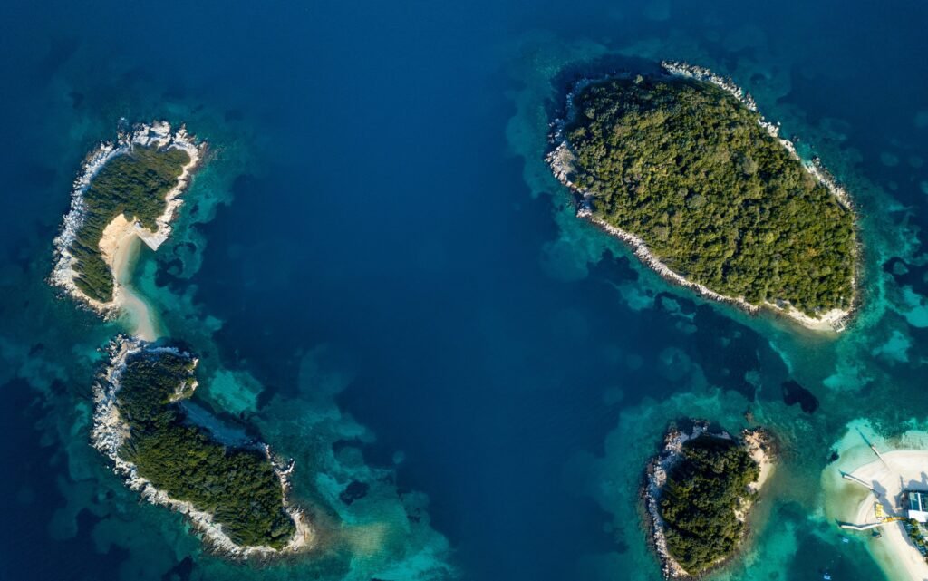 aerial vertical view of the 3 islands in ksamil albania placed in the ionian sea and underwater landscape